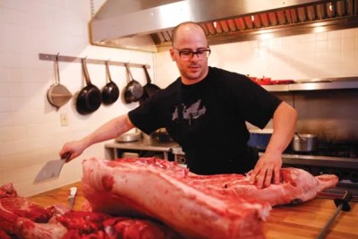 Cure’s Justin Severino offers hog-butchering demonstrations, with a meal
