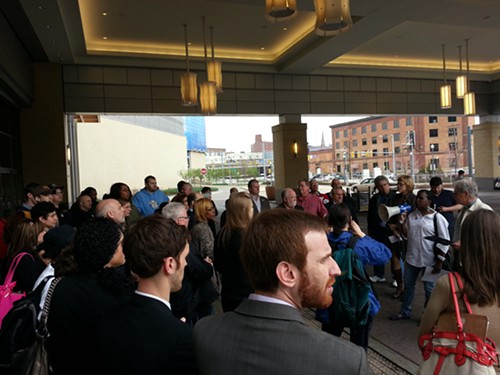 Dorothy Hall, a Rivers Casino employee, addresses her colleagues and local elected leaders outside the casino this morning.
