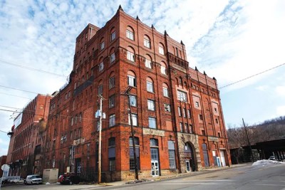 Brew House artists are renovating their South Side home, but not changing their mission