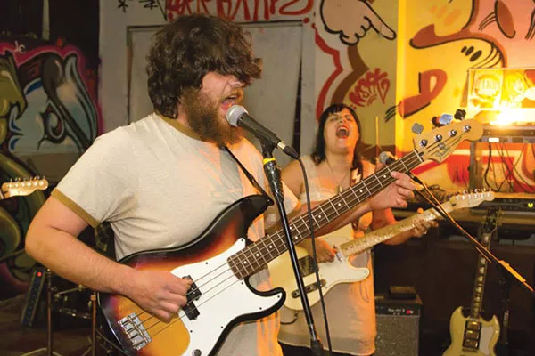 Seizure Man's Jacob Campbell, Molly Spear, playing in their band