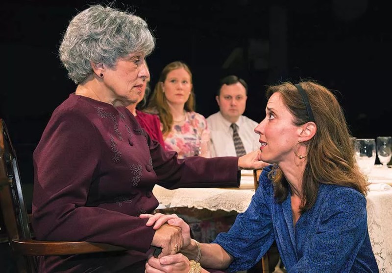To heir is human: Janet Robb (left) and Mary Liz Meyer, in the foreground, in Little Lake Theatre's Dividing the Estate