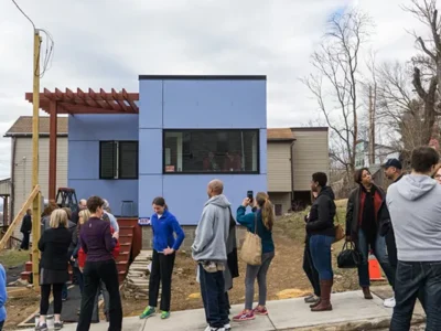 Residents line up to view the completed tiny house in Pittsburgh’s Garfield neighborhood