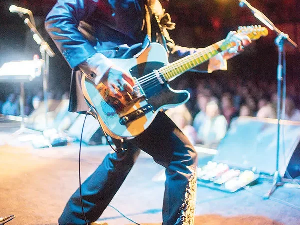 As guitarist of the Mavericks, Eddie Perez lives out his rock-god dreams in an unlikely forum