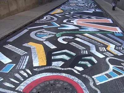 Artist brightens Pittsburgh’s Strawberry Way with mural underfoot