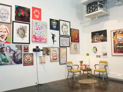 A unique art exhibit includes 250 portraits of a single subject — who’s also the docent