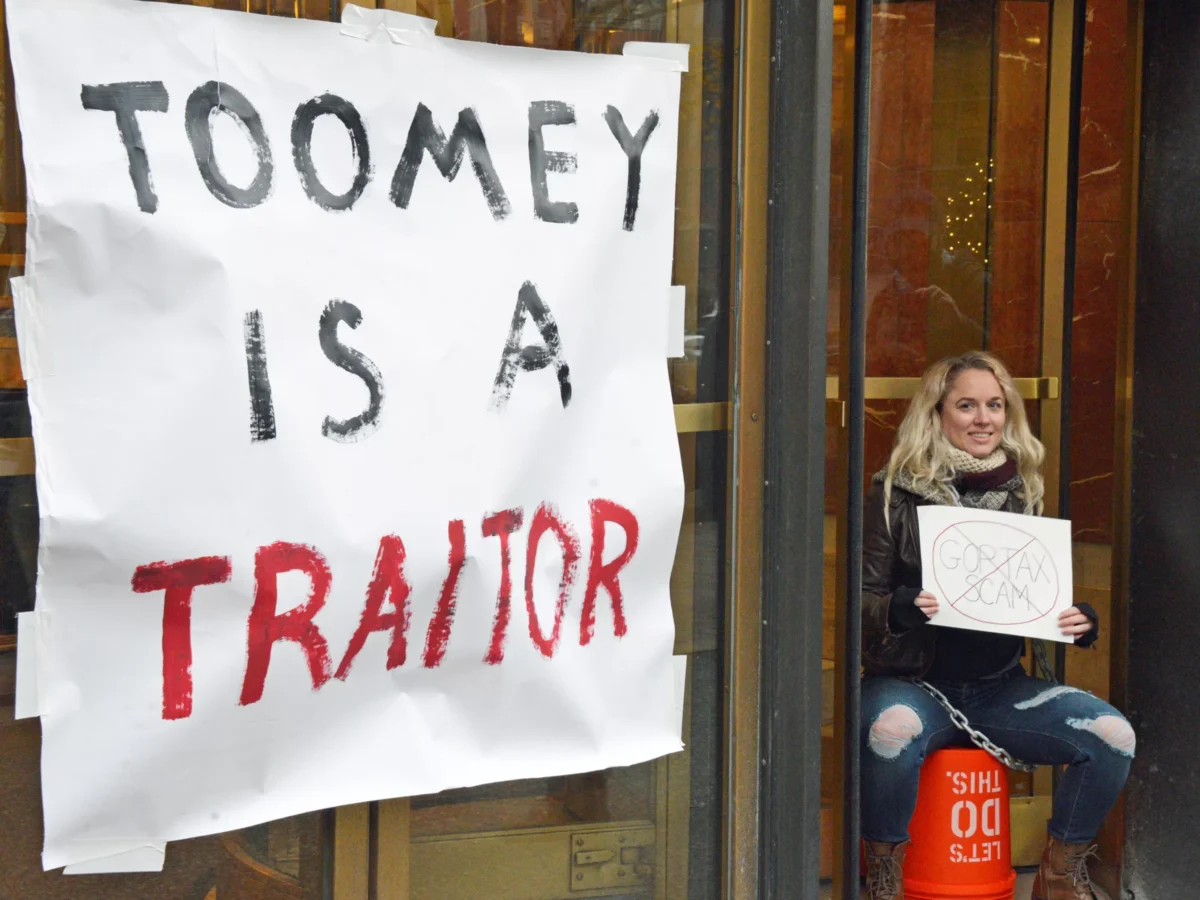 Protesters block entrance to Sen. Pat Toomey’s Pittsburgh office, hope to inspire more action against proposed tax bill
