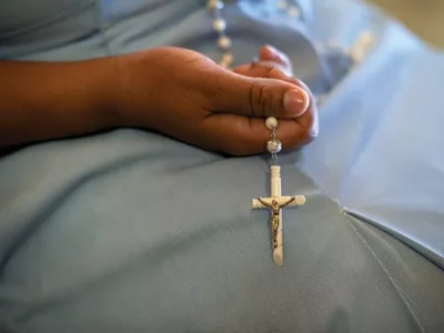 A devout Pittsburgh Catholic attends Mass following report on clergy sex abuse