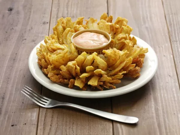 Put down that locally sourced chicken tender and grab yourself a Blooming Onion or Awesome Blossom or some other fried onion