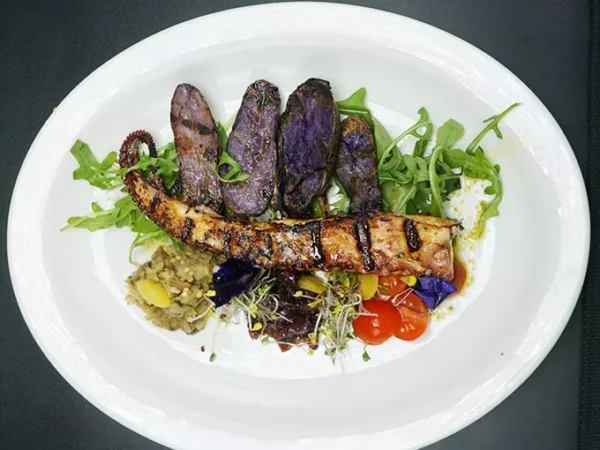 The new chef at Jean Louis would like you to come try the octopus