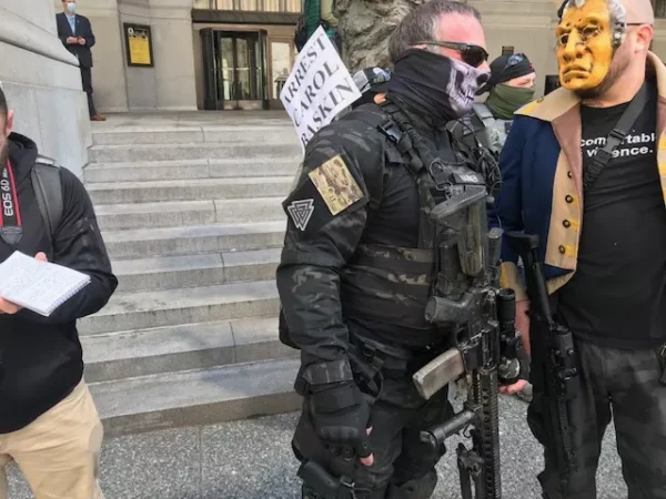 Armed civilian group at Pittsburgh’s reopen protest sports symbols linked to white nationalism
