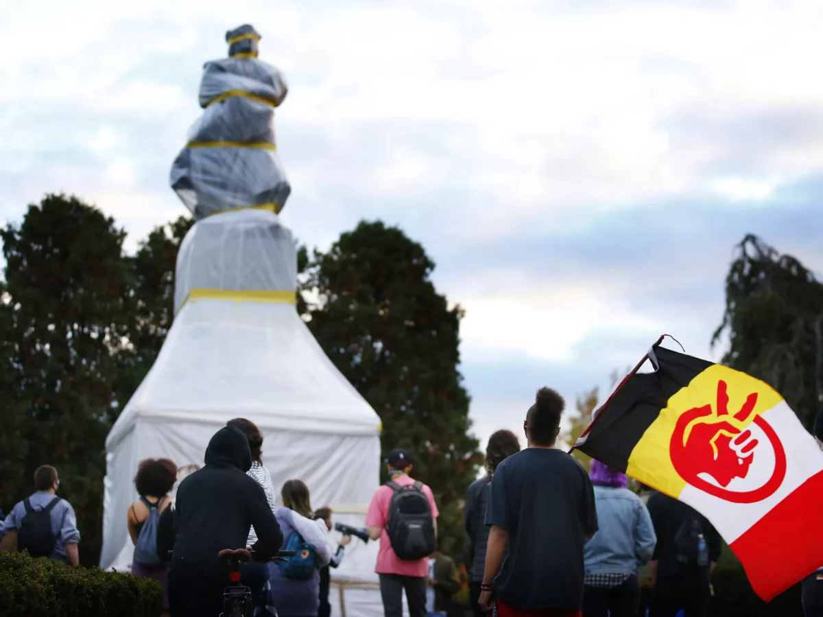 PHOTOS: Protesters call for the tearing down of Christopher Columbus statue on Indigenous Peoples’ Day
