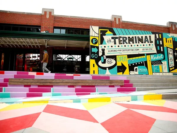 What happened to plans for a public market at the new Strip District development?