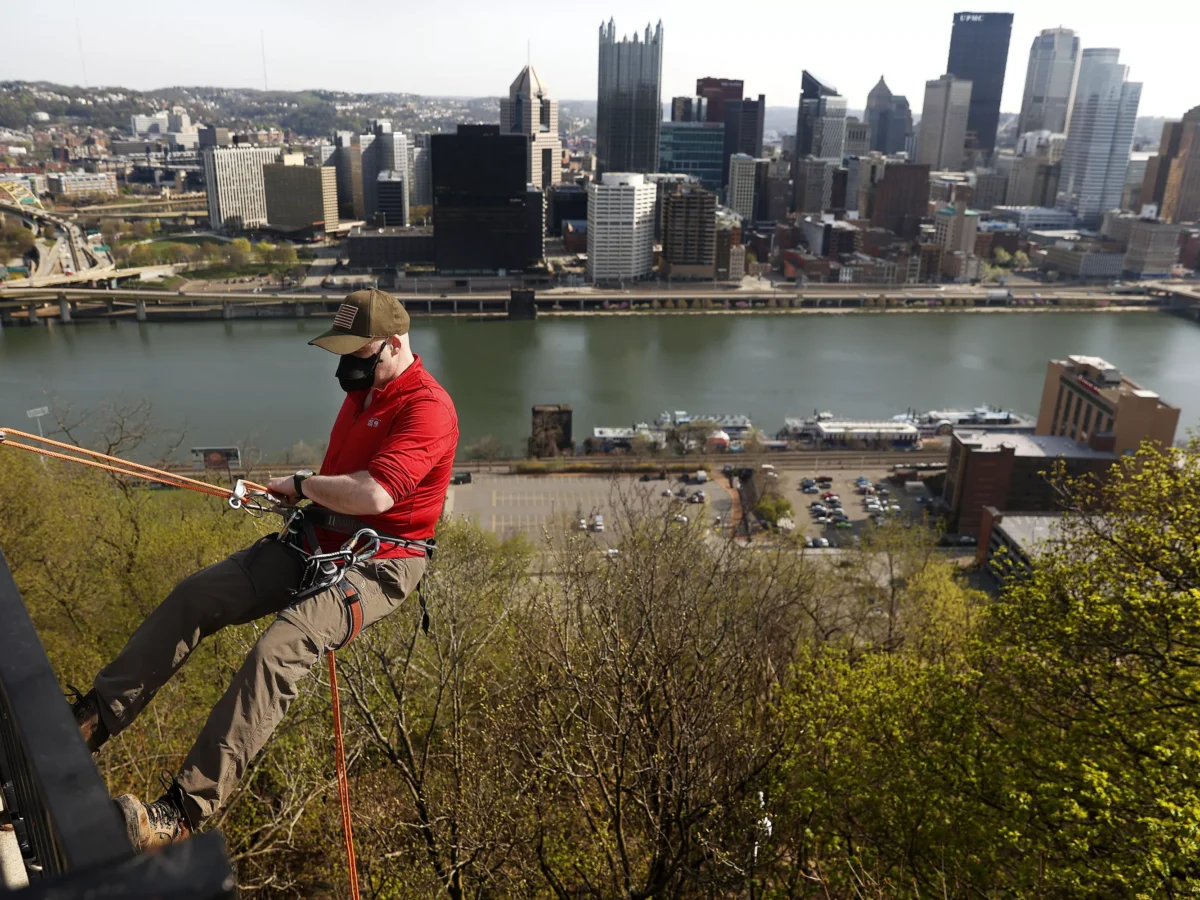 PHOTOS: Pittsburghers rappel down Mount Washington during 28th annual Emerald View Park cleanup