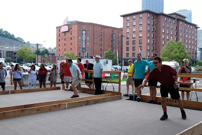 People gather to watch a bocce tournament near Heinz History Center in Pittsburgh.