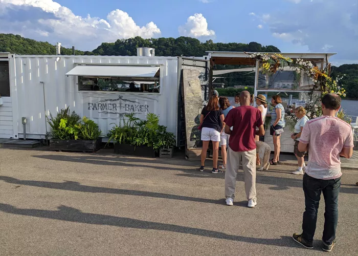 A line of people wait to order food at the Farmer x Baker restaurant in Fox Chapel.