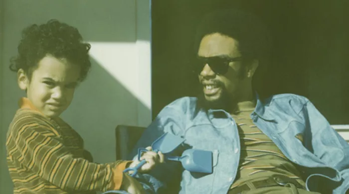 Album cover of Ben Harper's Bloodline Maintenance shows a man and a little boy outside. The boy holds two toy shovels.