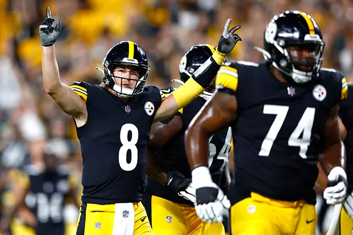 Two football players in black-and-gold uniforms
