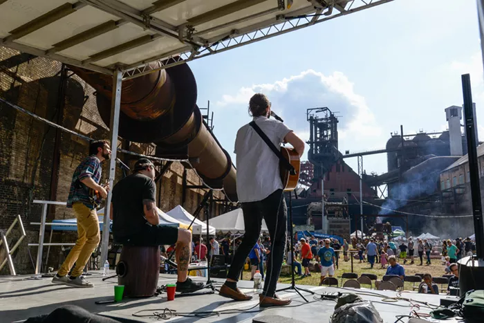 A band plays to a crowd at the Carrie Blast Furnaces.