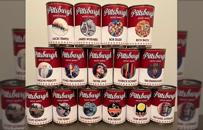 A stack of bright red Campbell's Soup cans features artwork by Pittsburgh artists.