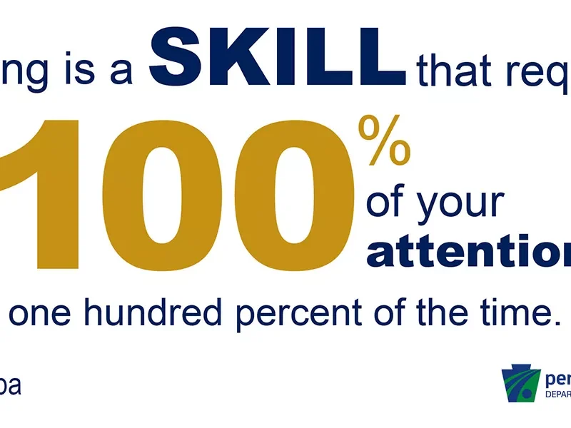 A graphic reading "driving is a skill that requires 100% of your attention"