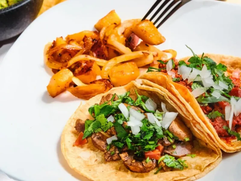 Birria tacos and potatoes on a large plate