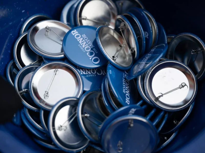 A basket of blue buttons reading "O'Connor for Mayor"