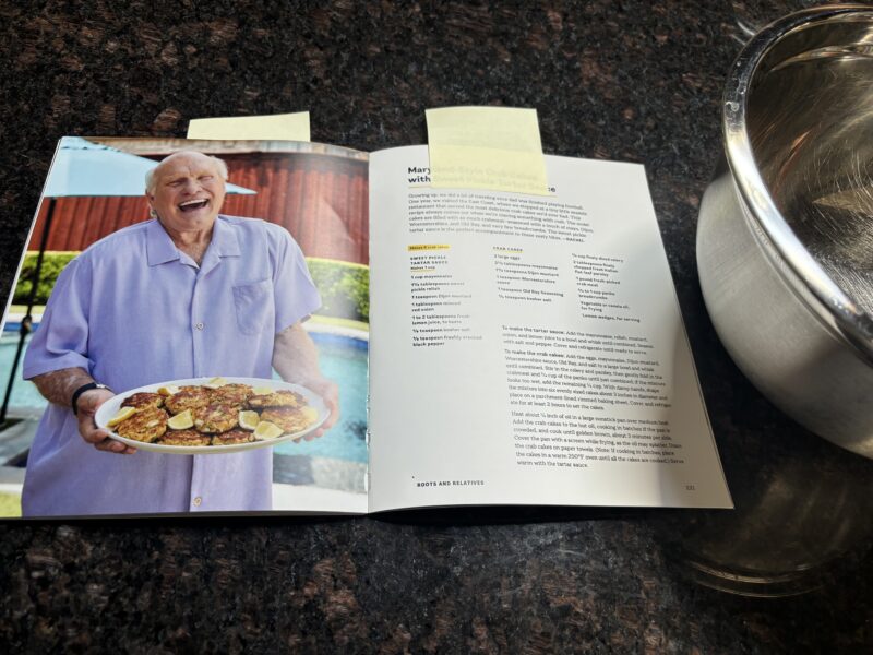 A look inside the cookbook as Terry smiles at his food.