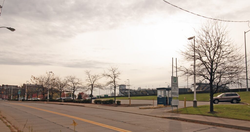 A parking lot near a large football stadium