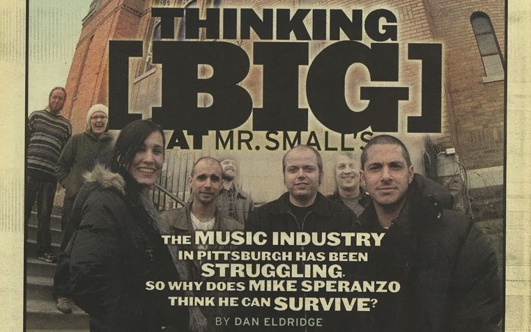 Four people on the cover of a newspaper reading Thinking Big at Mr. Smalls and showing five people in front of a repurposed church